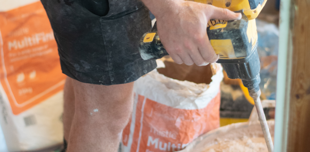 person mixing plaster